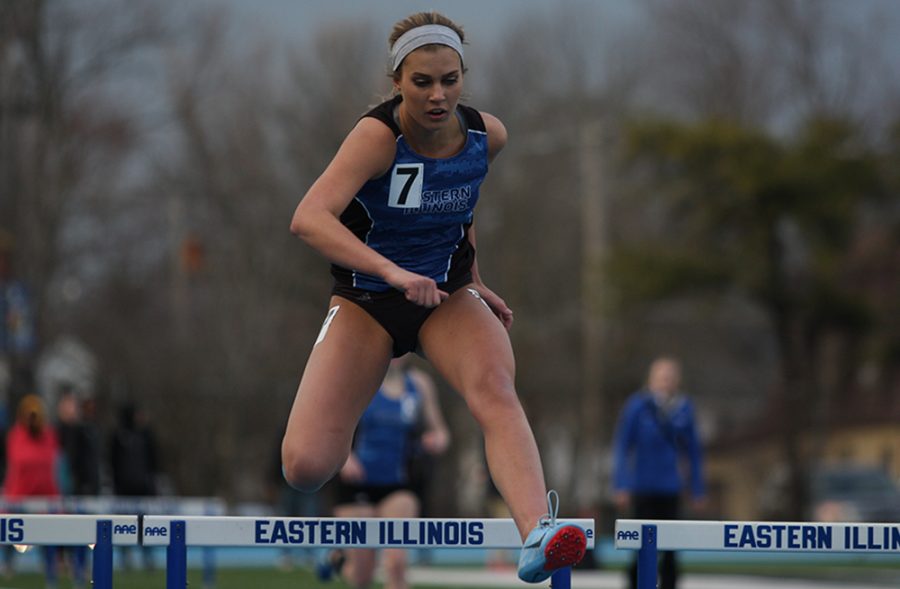 Eastern sophomore Morgan Atchison runs the 400-meter hurdles at the EIU Big Blue Classic at O’Brien Field on March 30 of last seasob. Atchison finished in 12th place in a time of 1 minute 8.36 seconds.