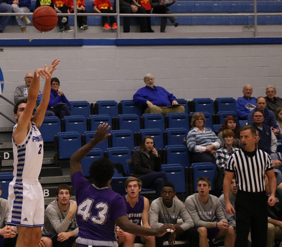 Josiah Wallace shoots a three-pointer from the corner during the Panthers’ 90-37 rout of Fontbonne University in Lantz Arena Tuesday night.