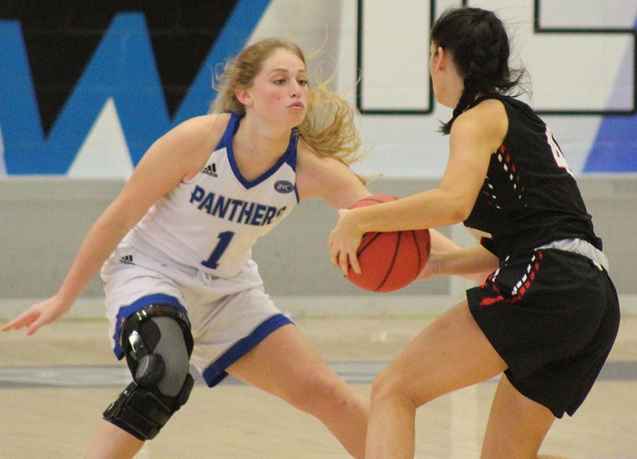 Eastern freshman Kira Arthofer defends a Lincoln Christian player during the first half of the game on Nov. 12. Arthofer had eight points, two assists and two rebounds in the 97-34 Eastern victory.