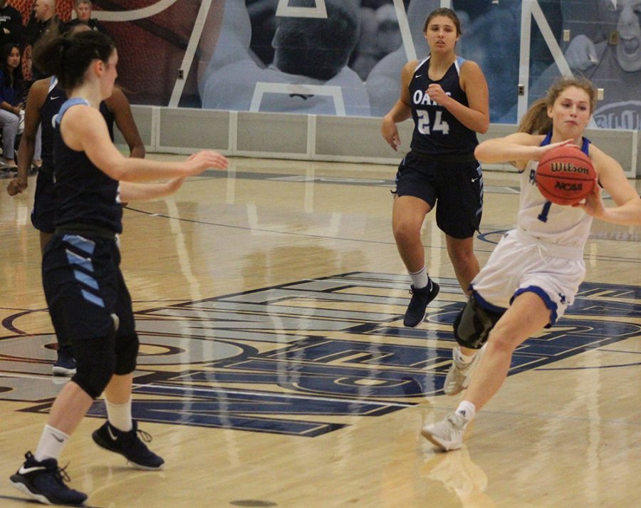 Kira Arthofer makes a pass during a fast break during the Panthers’ 102-43 season-opening victory against Oakland City on Nov. 6 in Lantz Arena.