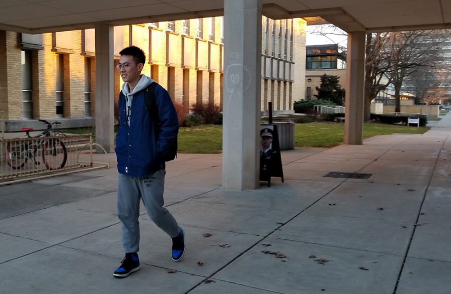 George Gao, a junior biological science major, takes a walk around campus Tuesday afternoon. He said he was enjoying the nice weather as he says, “It isn’t bad for January. It was really nice today.”