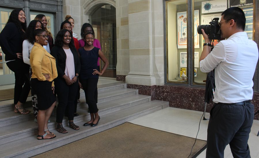 Warbler Photo Editor Qian Cheng (Fall 2018) takes a picture of the National Association of Colored Women’s Clubs Inc. for the Warbler Yearbook in Booth Library in October.