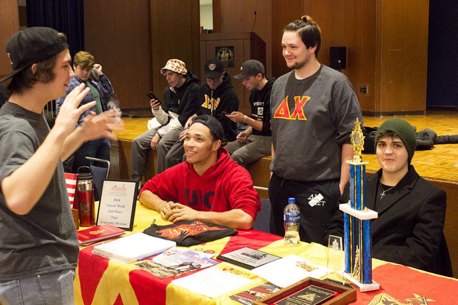 Students talk at the Delta Chi table Wednesday afternoon at Pantherpalooza in the University Ballroom.