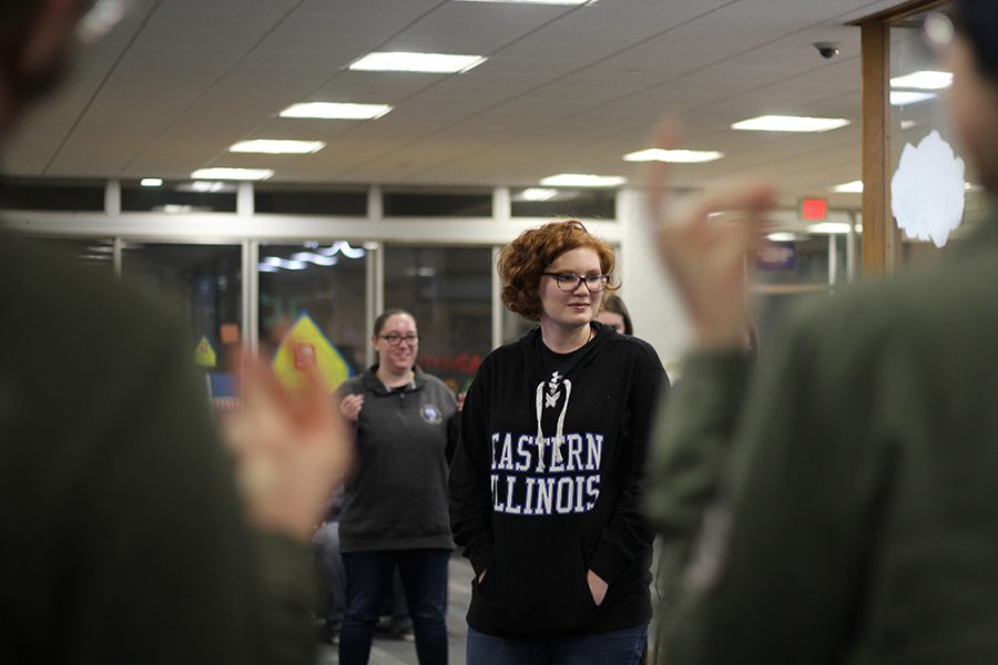 Julia Edwards, a freshman elementary education major, stands in the middle of a circle during an icebreaker activity in the Thomas Hall lobby Tuesday night. The icebreaker activity is for a new privilege program called Life in a Nutshell, where students can participate and interact to show that not everybody gets the same chances throughout life.