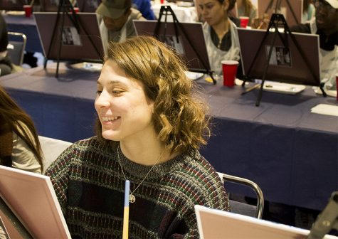 Lydia Schrock, a sophomore health promotions major, paints during a paint-and-sip that was a part of an event hosted by University Board. The event, Passport to Fun : France, was hosted in both ballrooms of the Martin Luther King Jr. University Union Wednesday afternoon.