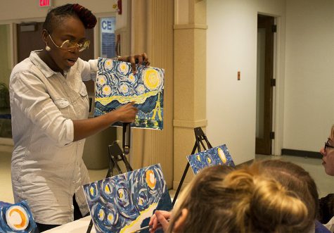 Kadija Robinson-Stallings, an Eastern alum, led a paint-and-sip for University Board’s Passport to Fun: France. This is Robinson-Stalling’s fifth time coming back to Eastern to lead a paint-and-sip. “I love coming here every year,” Robinson-Stallings said. “This is my school.”
