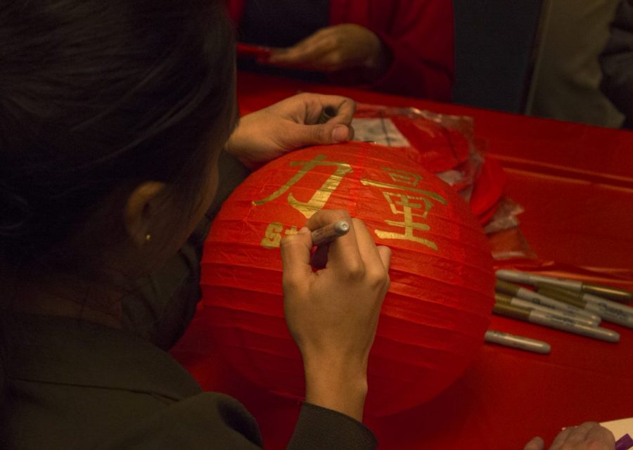 Raine Zhu | The Daily Eastern News
A student decorates a lantern at the Chinese New Year celebration Tuesday evening in the Martin Luther King Jr. University Union.