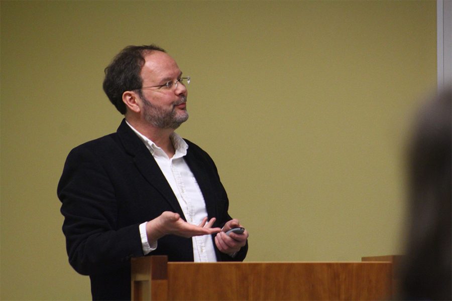 Tim Engles, an English professor, speaks at an event on Tuesday night called “White Man, Listen!” The event was held in room 4440 in Booth Library. “Angry white men… That’s basically my topic here,” Engles states after mentioning how he studies white masculinity. Engles spoke about white life novels, and read about Savage Holiday, a book by Richard Wright.