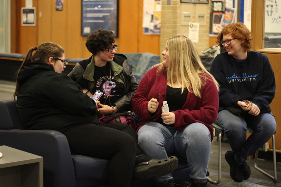 Morgan Bledsoe, a freshman journalism major, Journee Evans, a freshman english major, Makenna Boyd, also a freshman english major, and Lyric Ailshire, a freshman pre-medicine major, relax and enjoy themselves at the Thomas Hall Council Meeting held in the Thomas Hall lobby on Tuesday night.