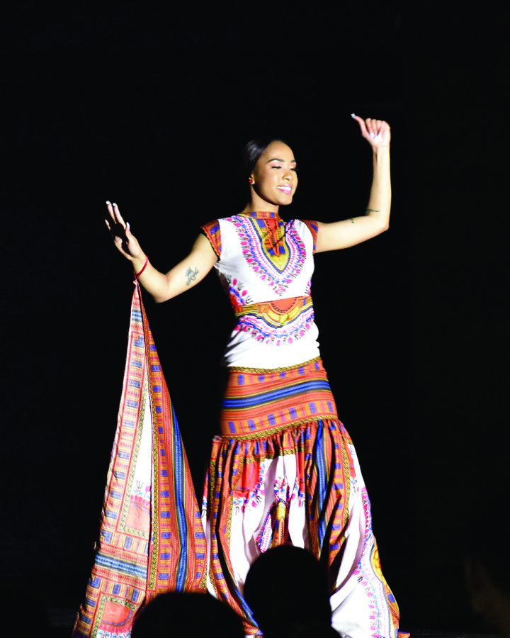 Latricia Booker, a sophomore pre-nursing major and one of the the contestants of the 48th annual Miss Black EIU scholarship pageant, dresses in African garment piece to show what she believes a strong African-American woman looks like in the Grand Ballroom of Martin Luther King Jr. Union on Saturday night.