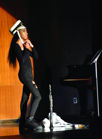 Melea Burkes, a freshman neuroscience major, plays the flute as her individual talent portion during the 48th annual Miss Black EIU scholarship pageant in the Grand Ballroom of the Martin Luther King Jr. Union on Saturday night.