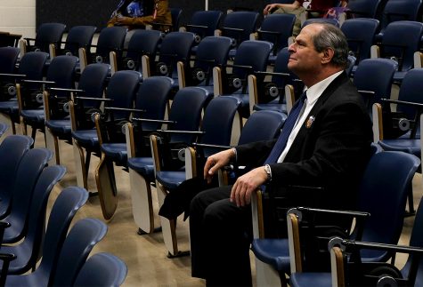 President David Glassman, sits and watches the Historical Twist NAACP Jeopardy game Monday night in the Coleman Auditorium.