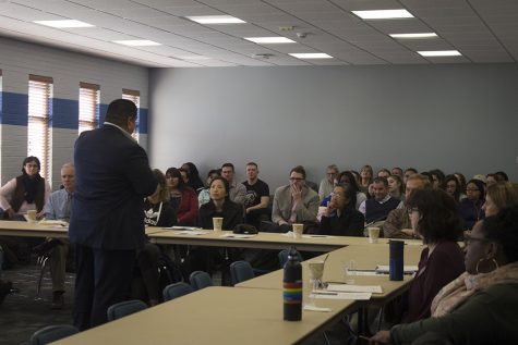 The audience listens as author Sammy Rangel gives his speech, “A life born of a thousand wounds” at the 2019 ICGD Symposium. The symposium was held in the Arcola/Tuscola room in the Martin Luther King Jr. University Union on Tuesday evening.