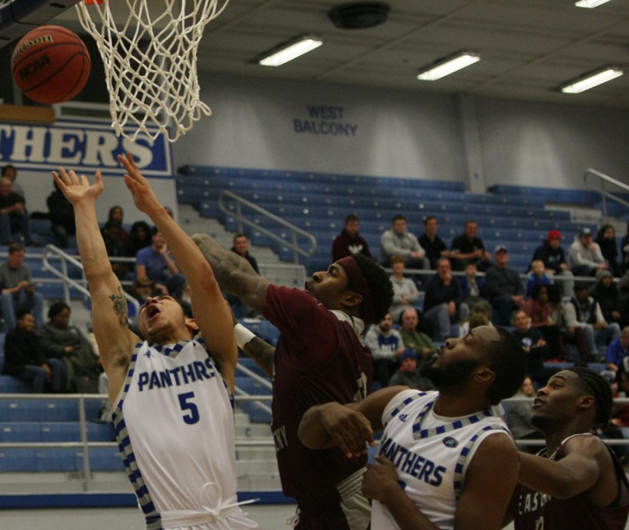 Shareef Smith takes a layup attempt while an Eastern Kentucky defender tries to swat it away during Eastern’s 67-66 victory in Lantz Arena Jan. 31.