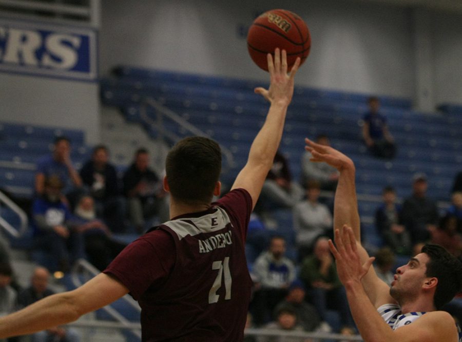 Josiah Wallace attempts a floater in the lane as an Eastern Kentucky defender flies to try and block it during Eastern’s 67-66 victory in Lantz Arena Jan. 31.