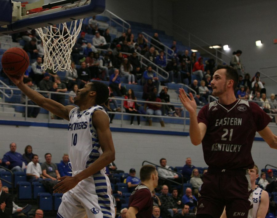 Cam Burrell attempts a reverse layup as an Eastern Kentucky defender misses his block attempt during Eastern’s 67-66 victory in Lantz Arena Jan. 31.