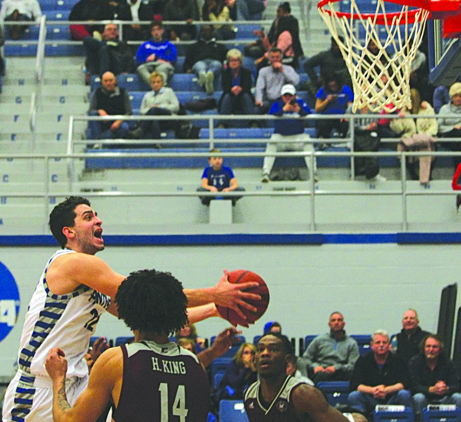 Jordan Boyer | The Daily Eastern News
Josiah Wallace flies through defenders to attempt a layup during Eastern’s 67-66 victory in Lantz Arena Jan. 31.