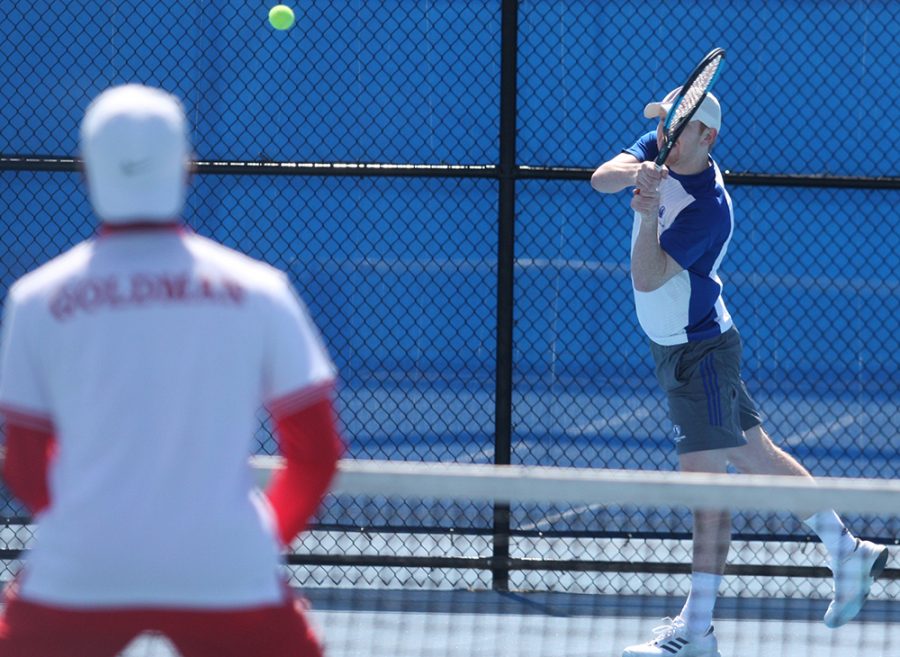 Freddie O’Brien returns a hit during the Eastern men’s tennis match against Belmont in March 2018. Belmont swept Eastern 7-0.
