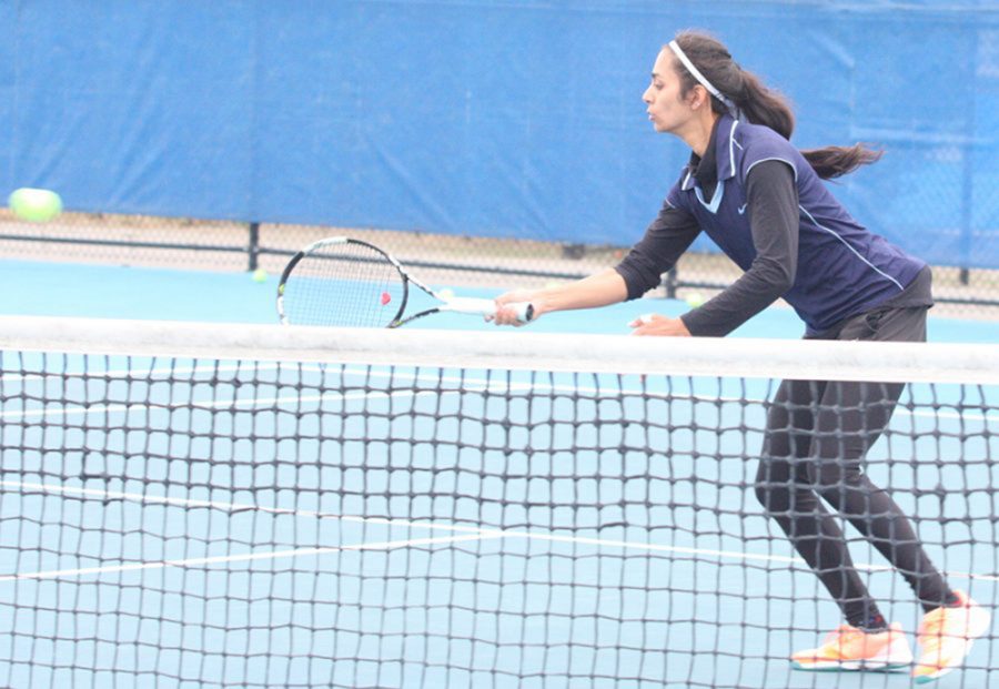 Eastern’s Srishti Slaria returns a ball at the Darling Courts in a meet this fall. Slaria is a senior on Eastern’s tennis team.