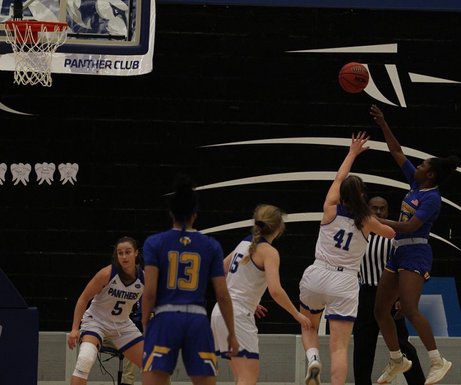 Abby Wahl jumps to try and block a shot from a Morehead State player during Eastern’s 67-57 loss in Lantz Arena Saturday.