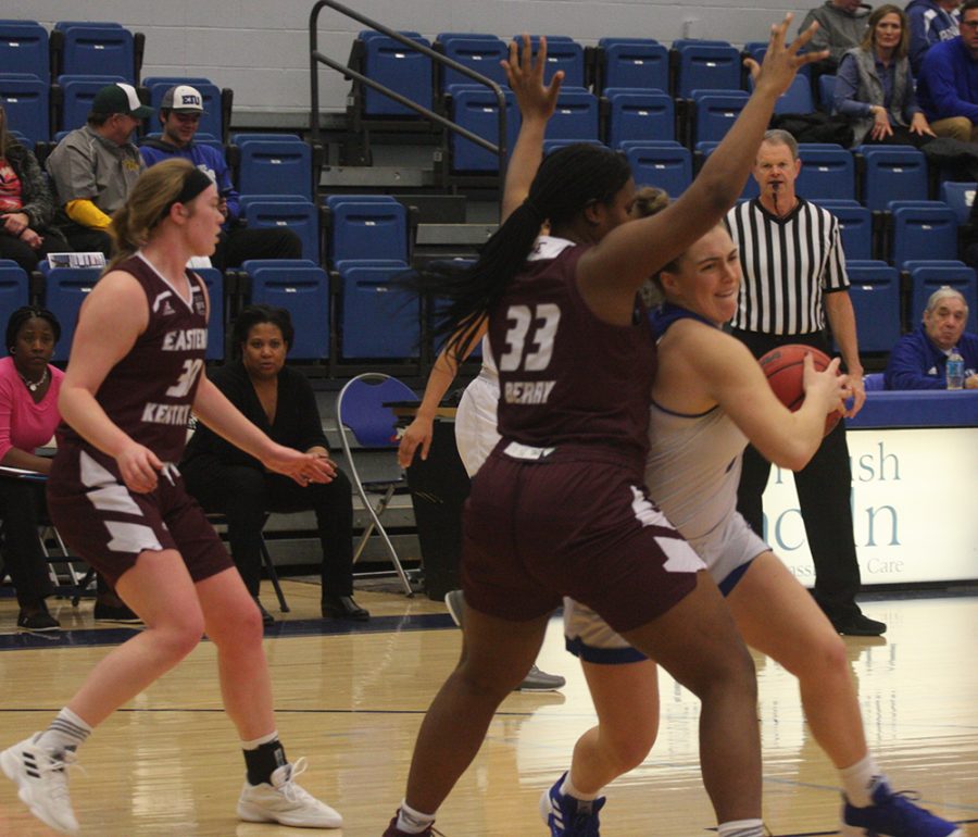 Grace McRae tries to get around an Eastern Kentucky defender in the post during Eastern’s 80-60 victory in Lantz Arena Jan. 31.