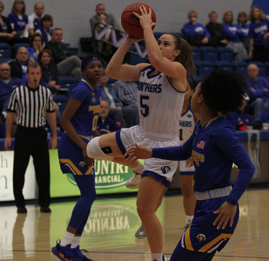 Dillan Schorfheide | The Daily Eastern News
Grace Lennox elevates for a jump shot with a Morehead State defender right next to her during Eastern’s 67-57 loss in Lantz Arena Saturday.