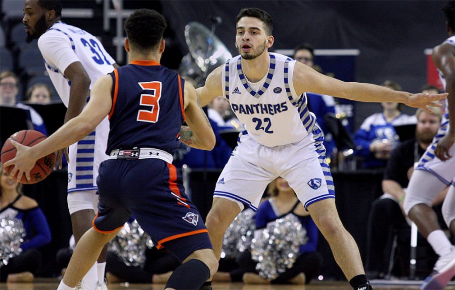 Easterns Josiah Wallace plays defense on Tennessee-Martins Kevin Little in the first half of Easterns 78-71 loss to the Skyhawks Wednesday night in Evansville. Wallace was named first-team all-conference and is making his first appearance in the conference tournament.