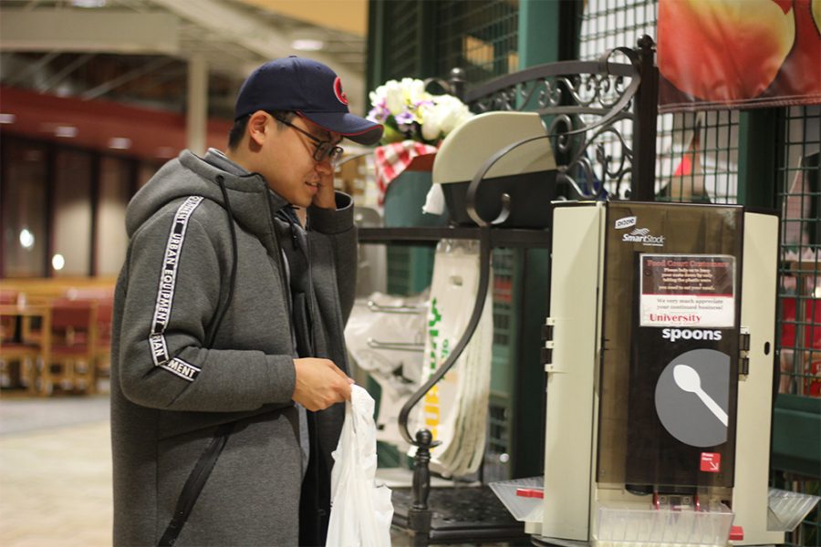 Seonghwan Kim, a graduate student in history, stops by the Martin Luther King Jr. University Union for a quick snack on Sunday night. Kim said he is preparing for classes tomorrow.