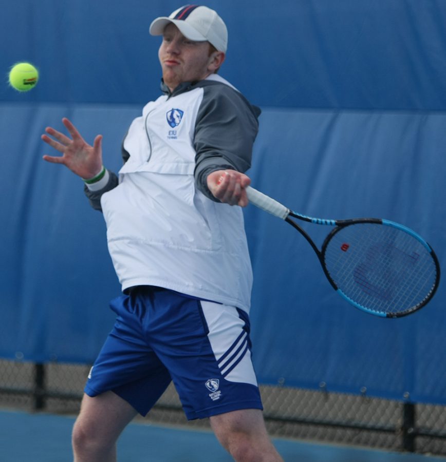 Freddie O’Brien rears back to return a hit in his singles match during Eastern’s 6-1 loss to Jacksonville State at the Darling Courts Friday.