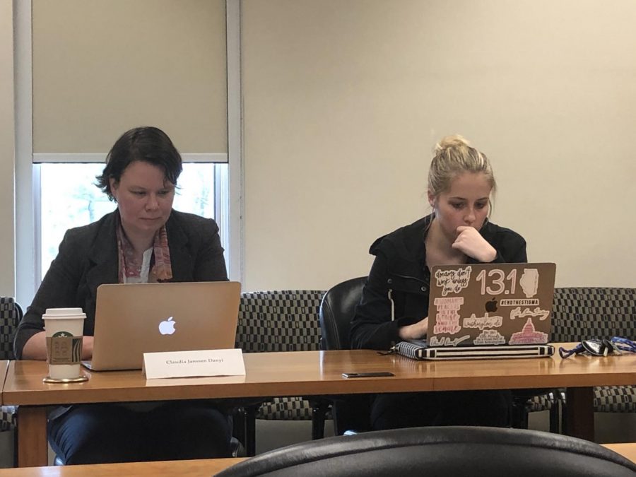 Claudia Janssen Danyi, Council on Academic Affairs member, and Carson Gordon, CAA student member, look at the agenda for the CAA meeting Thursday. Janssen Danyi was voted to be the vice chair of CAA for the 2019-2020 academic year.