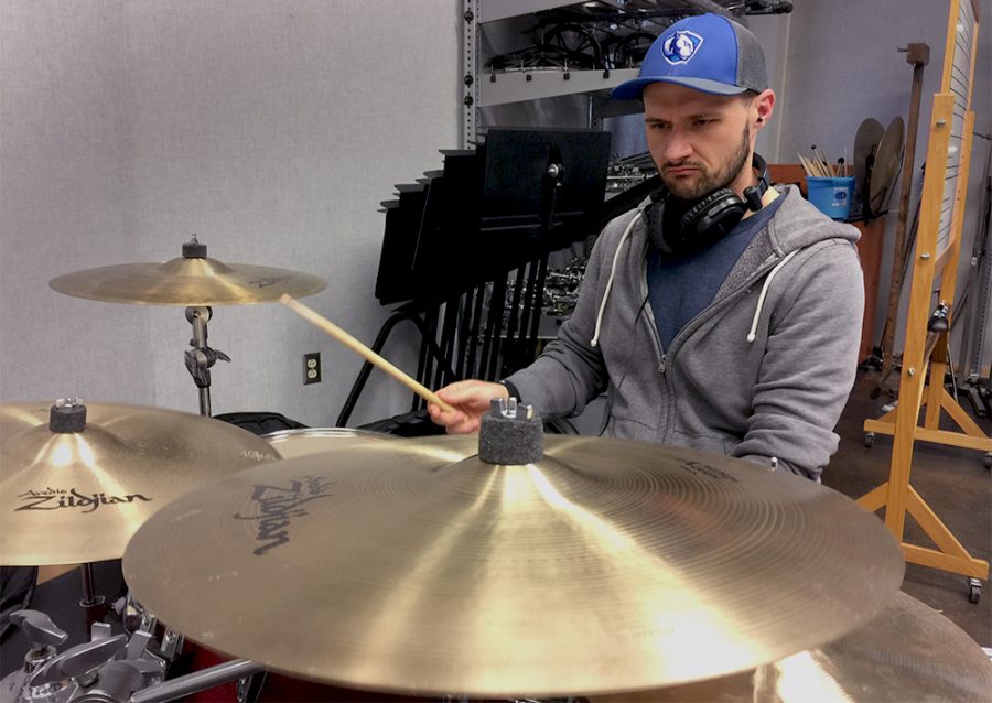 Chris Aghaei, a music major who just graduated in May, practices music reading and drumming at the Percussion Lab of the Doudna Fine Arts Center. 