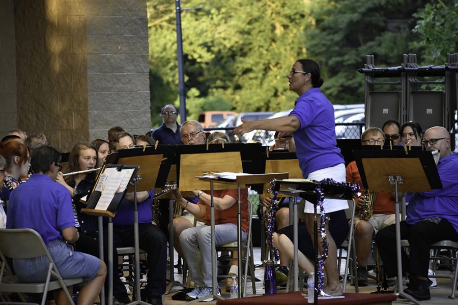 Director Ginger Stanfield conducts the Charleston Community Band as it performs Amazing Grace at the Kiwanis Park Thursday evening.

