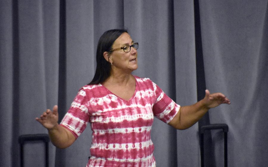 Director Ginger Stanfield conducts the Charleston Community Band as it performs “Pop Culture” and “The Beach Boys Greatest Hits” in the Band Rehearsal Room of the Doudna Fine Arts Center Tuesday evening.