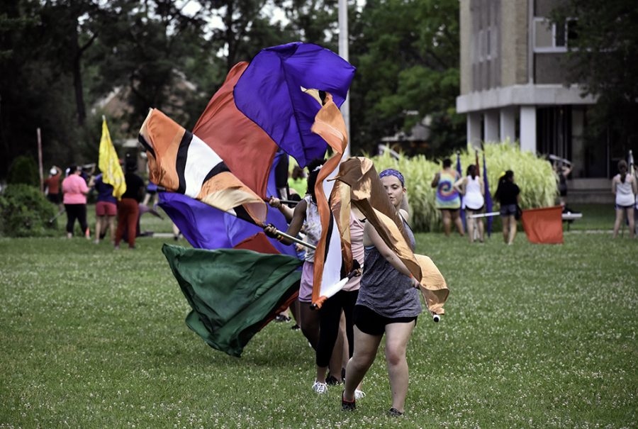 Students in the Adventure Flag and Camp Rifle Clinic from Smith Walbridge Clinics practice color guarding at the South Quad Wednesday evening.