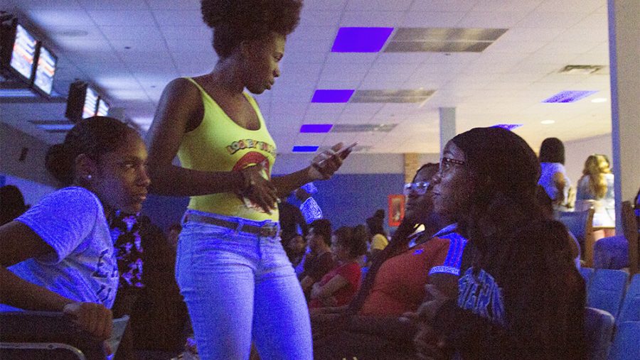 Elishia Wright (left), a freshman psychology major, Heaven Jackson (middle), a freshman majoring in finance, and Kyla Kyles, a freshman business managment, bowl during the Ice Cream Party that was hosted by the Black Student Union at EIU Lanes on Tuseday night. The Vice President of the Black Student Union, Shariah Campbell, who is a junior majoring in human service and community leadership, said the event was mainly focused on bringing students together.