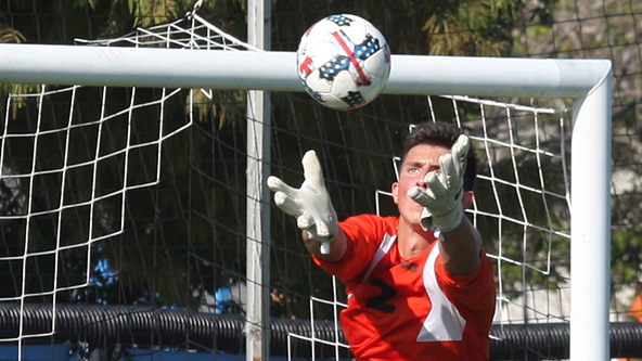 File Photo | The Daily Eastern News
Eastern goalkeeper Jonathan Burke skies over an attacker to make a save during the men’s soccer team’s double-overtime 1-1 tie with Evansville in August 2018 at Lakeside Field.