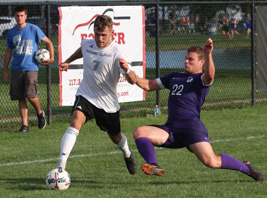 File Photo | The Daily Eastern News
Jake Andrews fends off a sliding defender while making a move with the ball during Eastern’s 0-1 loss to Green Bay at Lakeside Field in September 2018.