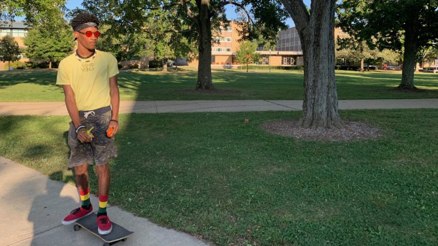 Coby Oliver, an undecided freshman, skateboards back to Taylor Hall Wednesday afternoon. Oliver was skateboarding back from Mindfulness Club and received free fruit while at the club. Oliver explained he skates around on campus “for the most part.” 
