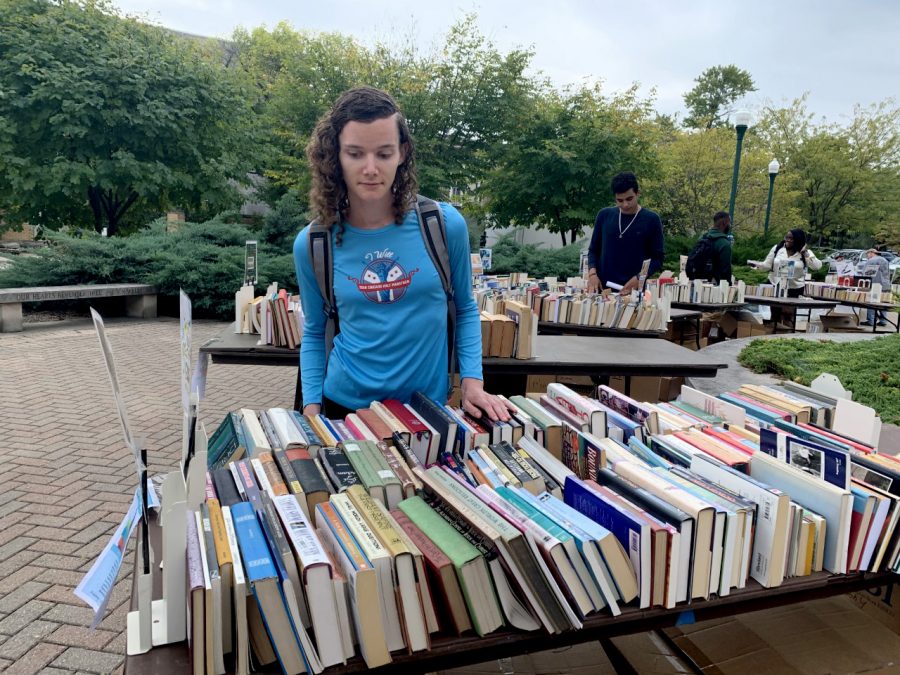 Danielle Lindblad, a graduate student studying exercise science looks through the religious section. Lindblad was trying to find a Koran but was unable to find one but continued to look through the books to see what she can find.