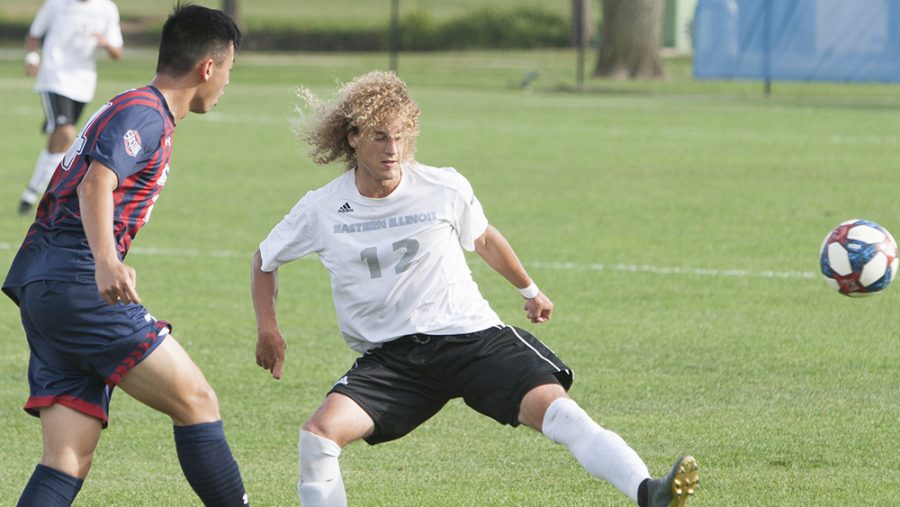 Cameron Behm kicks his leg out to block the opponent’s pass attempt near the sideline. Eastern defeated Belmont 3-2 in overtime Tuesday at Lakeside Field.