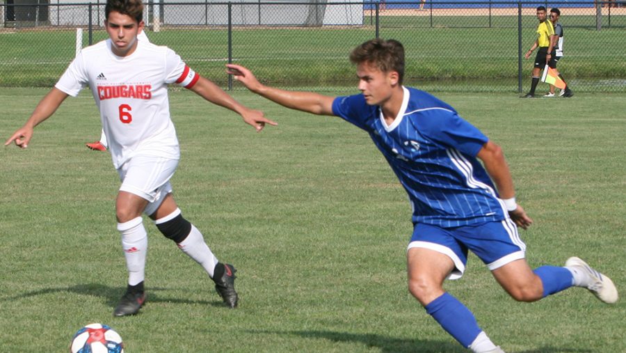 Karina Delgado | The Daily Eastern News
Christian Sosnowski runs to gain possession of the ball as a defender starts to guard him. Eastern defeated St. Xavier Tuesday in its home opener 2-0 at Lakeside Field.