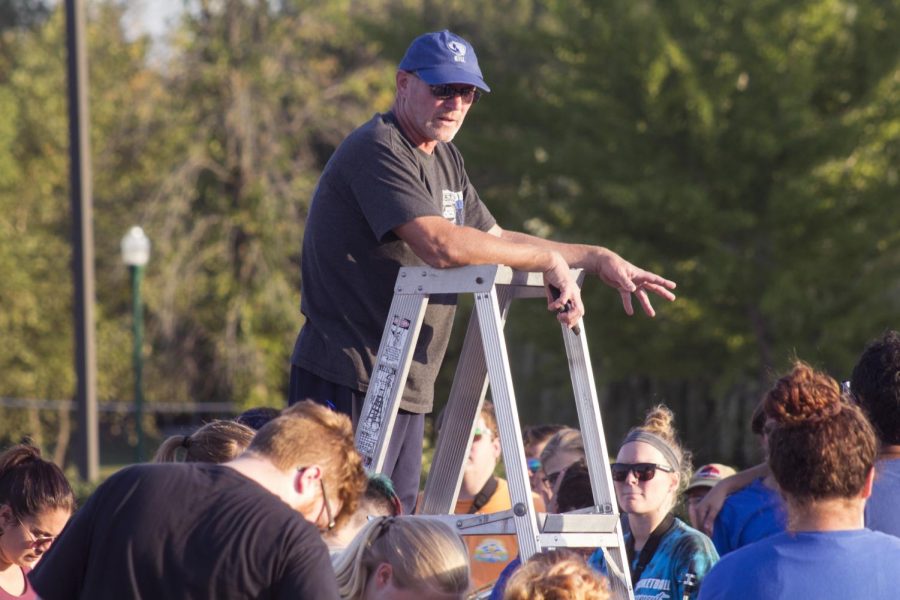 David Boggs, assistant director of bands, adresses the Panther Marching Band after a Sept. 27 rehearsal at the Greek Court parking lot. The PMB Festival will be Saturday, and the first performance is at 9:30 a.m.