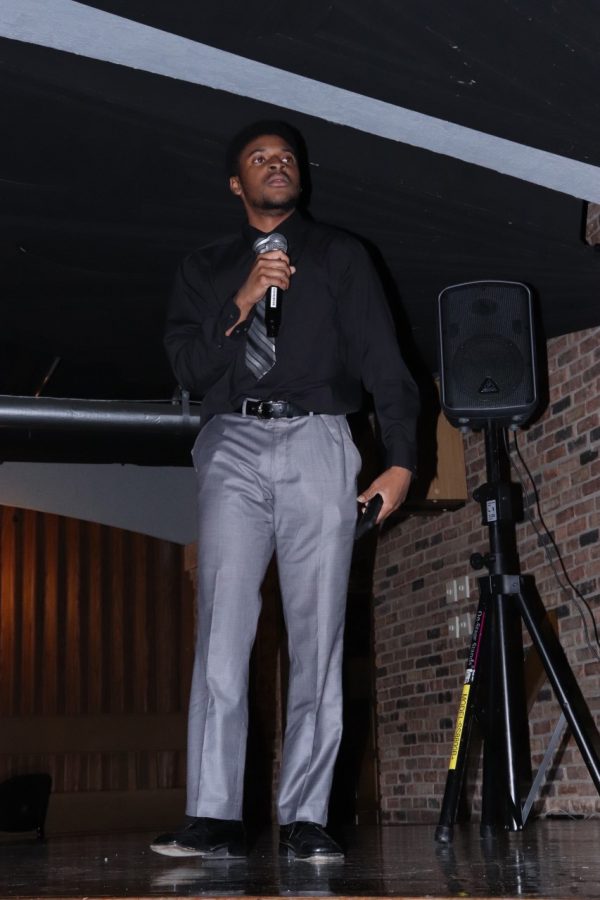 Jeremiah Boyd-Johnson, a criminology major, recites the poem Assassination during the Black Student Unions open mic night at the Seventh Street Underground Monday evening.