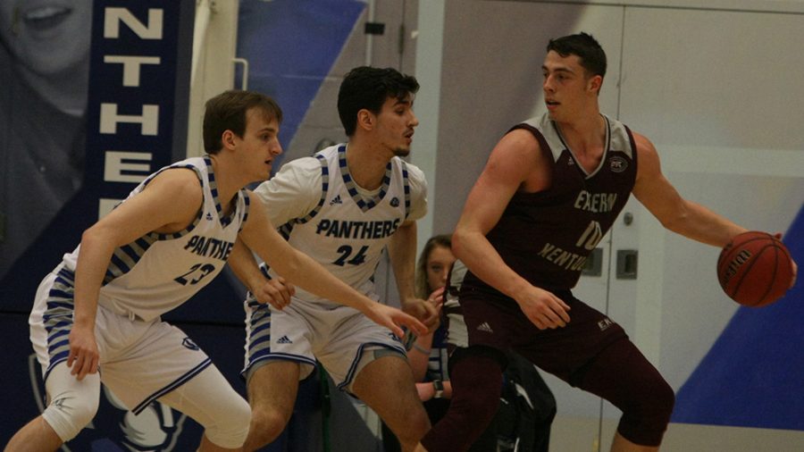 File Photo | The Daily Eastern News
Ben Harvey (left) and Rade Kukobat (middle) defend Nick Mayo as he backs down in the post, along the baseline. Eastern defeated Eastern Kentucky 67-66 Jan. 31 in Lantz Arena.