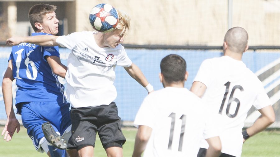 Dillan Schorfheide | The Daily Eastern News
Quinn Rechner goes up for a head ball against an attacker, banging bodies with the attacker. Eastern tied Omaha 0-0 in double overtime Oct. 19 at Lakeside Field.