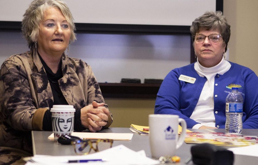 Sheila Greuel (right), a geriatric services manager, listens as Michelle Matteson, a hospice manager and death doula worker, as she discusses what death doulas do and her own experiences as a death doula during “Death Doulas: End of Life Role” at Blair Hall Thursday morning. Matteson said death doulas help fill in for hospice workers since hospice may not have time for too many questions. Death doulas also help support the family and patient emotionally.