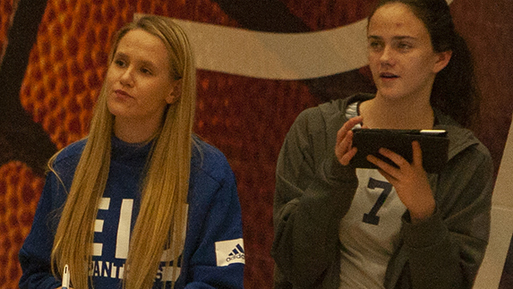 Adam Tumino | The Daily Eastern News
Eastern freshmen Kristen Jankowski (left) and Mackenzie Duvall keep stats from the sideline during the Panthers’ five-set win against Chicago State Nov. 11 in Lantz Arena.