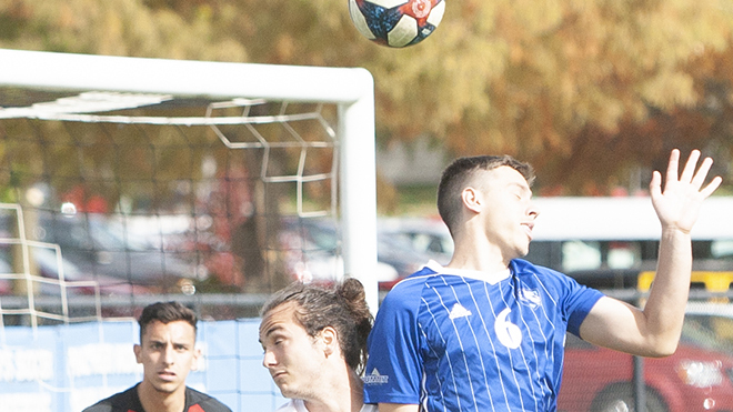 Dillan Schorfheide | The Daily Eastern News
Davi Girardi (right) shields his eyes from the sun as he fights to win the ball out of the air. Eastern tied Omaha 0-0 at Lakeside Field Oct. 19.