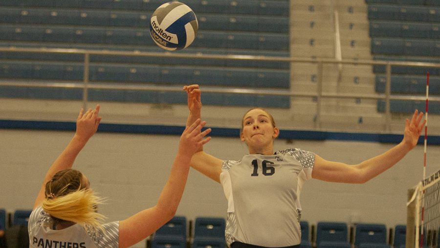 Eastern senior Maggie Runge jumps to kill a set from Bailey Chandler in the Panthers’ five-set win over Chicago State Nov. 11 in Lantz Arena. Runge’s .571 hitting percentage in the match led all players and her 17 kills tied for the second-most on the team.