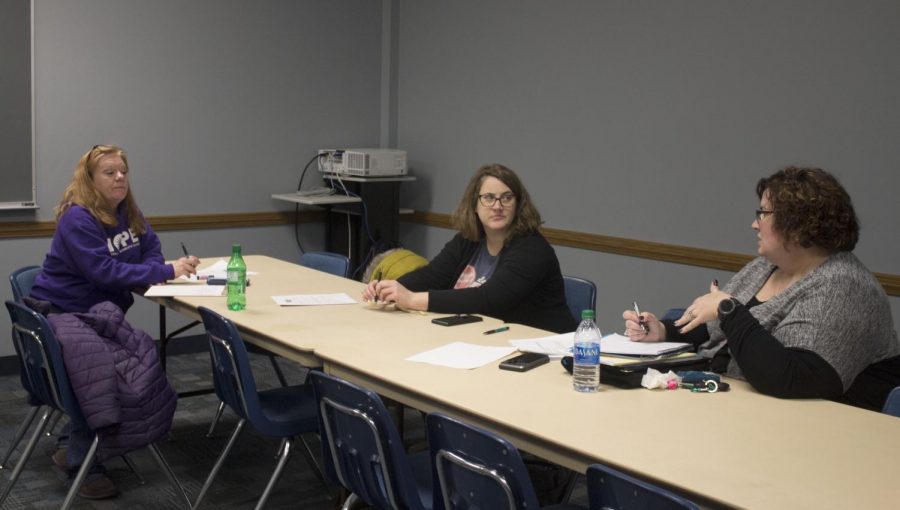 Angie Hunt (left), Rachel Heicher and Erin Walters from SACIS and HOPE prepare material for students to come in to audition for “The Vagina Monologues” in the Casey Room at the Martin Luther King Jr. University Union Wednesday night. Auditions will continue Thursday night from 6 p.m. to 8:30 p.m. at 825 18th St. 